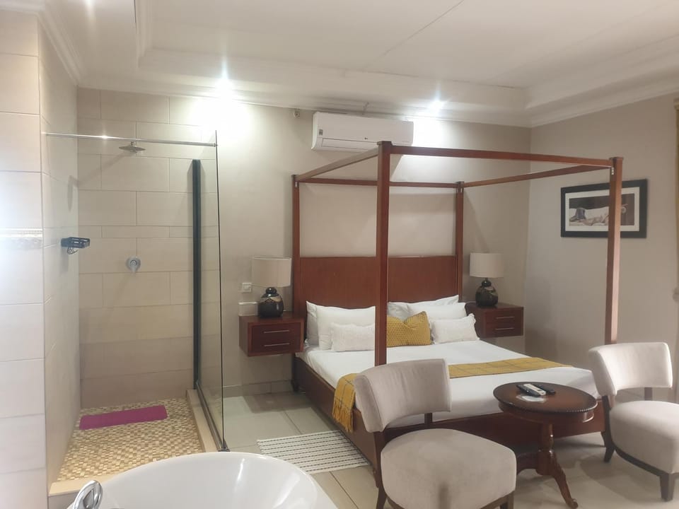 Shower, Bed, Seating area, Bedroom, air conditioner