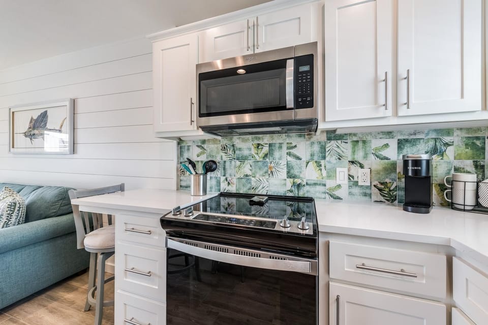 Coffee/tea facilities, Kitchen or kitchenette, furniture, microwave, stove