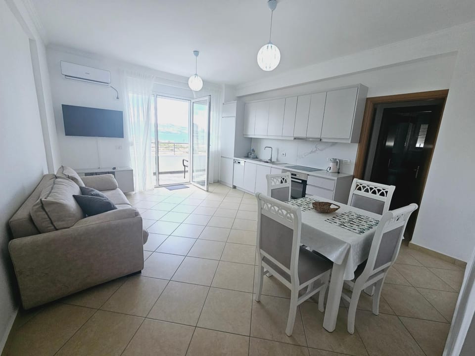 TV and multimedia, Kitchen or kitchenette, Living room, Seating area, Dining area, oven, stove, air conditioner