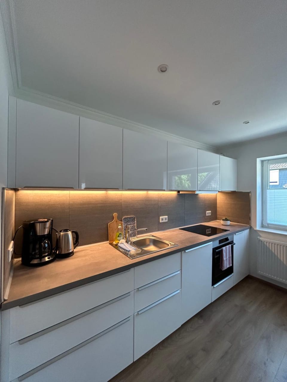 Kitchen or kitchenette, dishwasher, stove, toaster