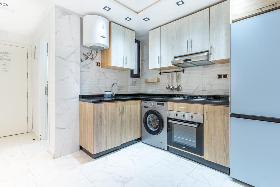 Kitchen or kitchenette, oven, stove, washing machine