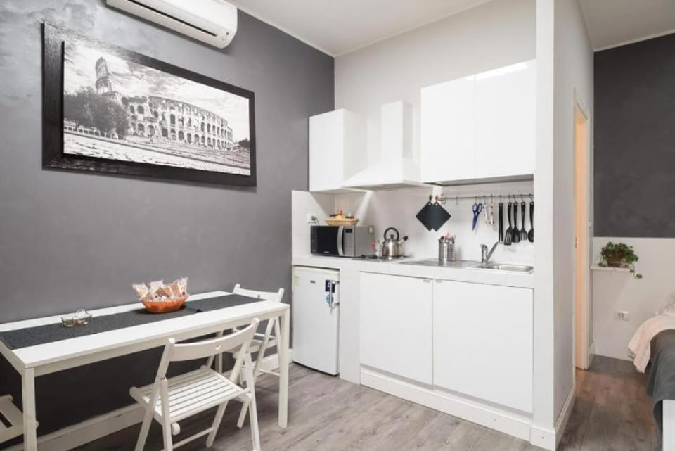 Kitchen or kitchenette, stove, air conditioner