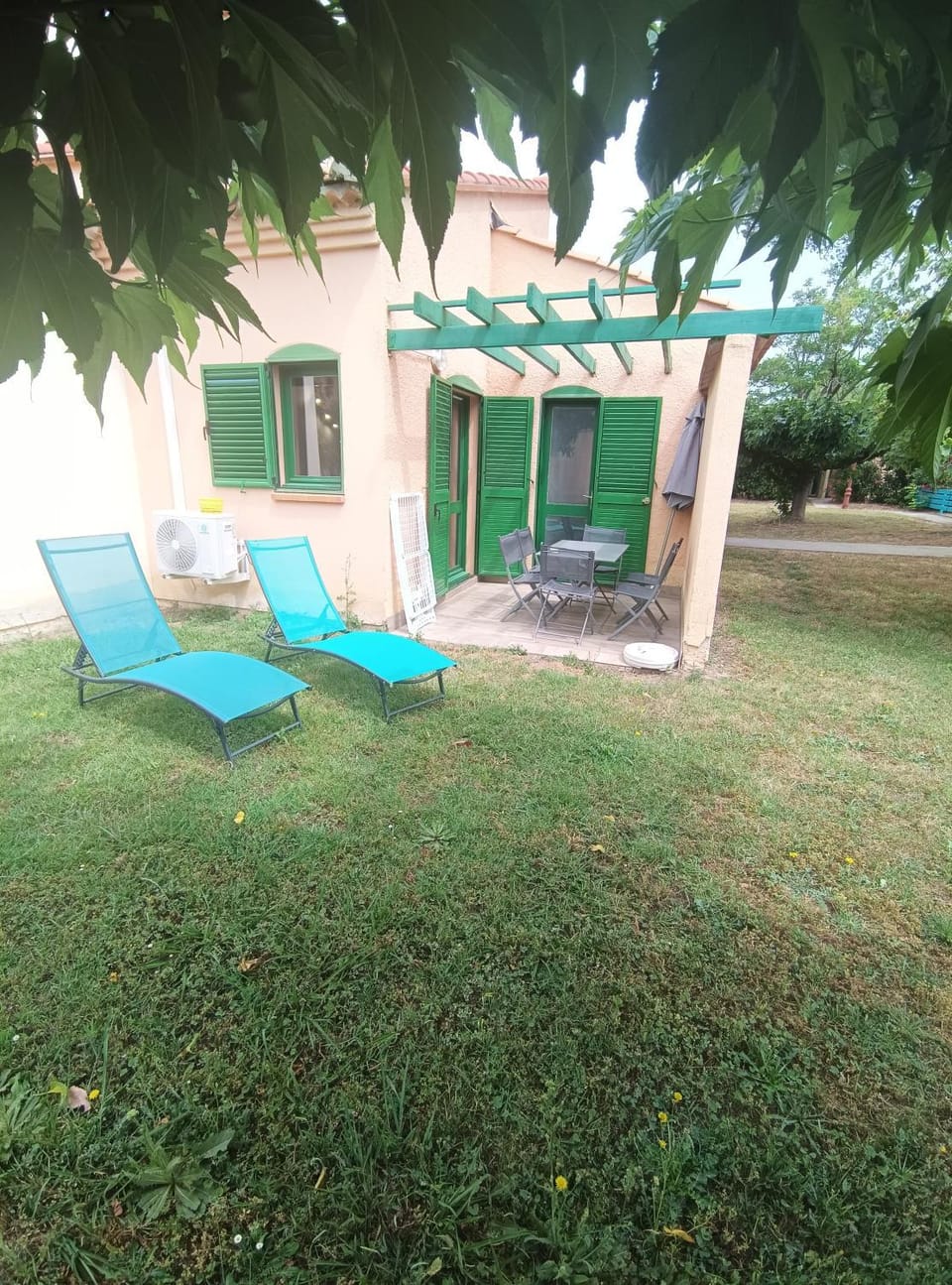 Property building, Patio, Natural landscape, Balcony/Terrace, furniture, sunbed, air conditioner