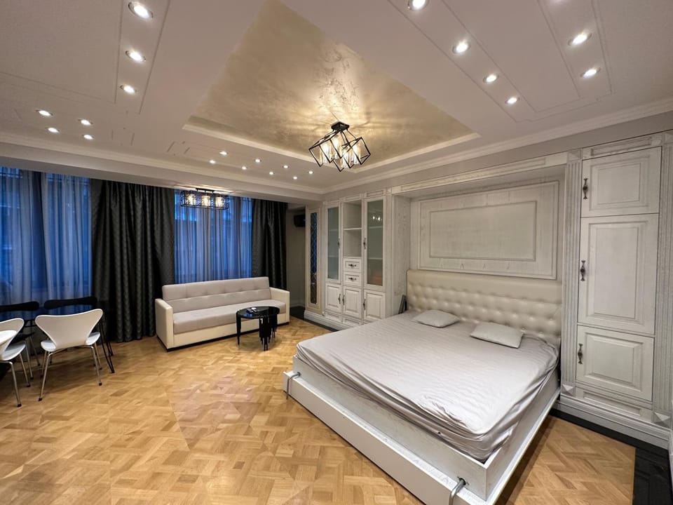Bed, Living room, Seating area, Bedroom