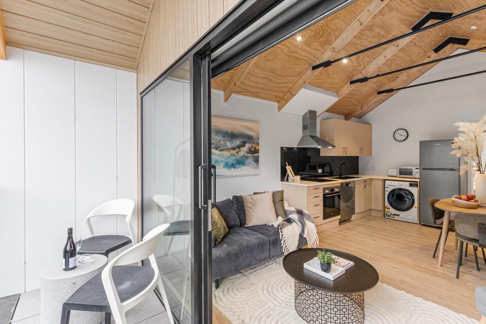 Kitchen or kitchenette, Living room, Seating area, Dining area, dishwasher, oven, stove, toaster, washing machine