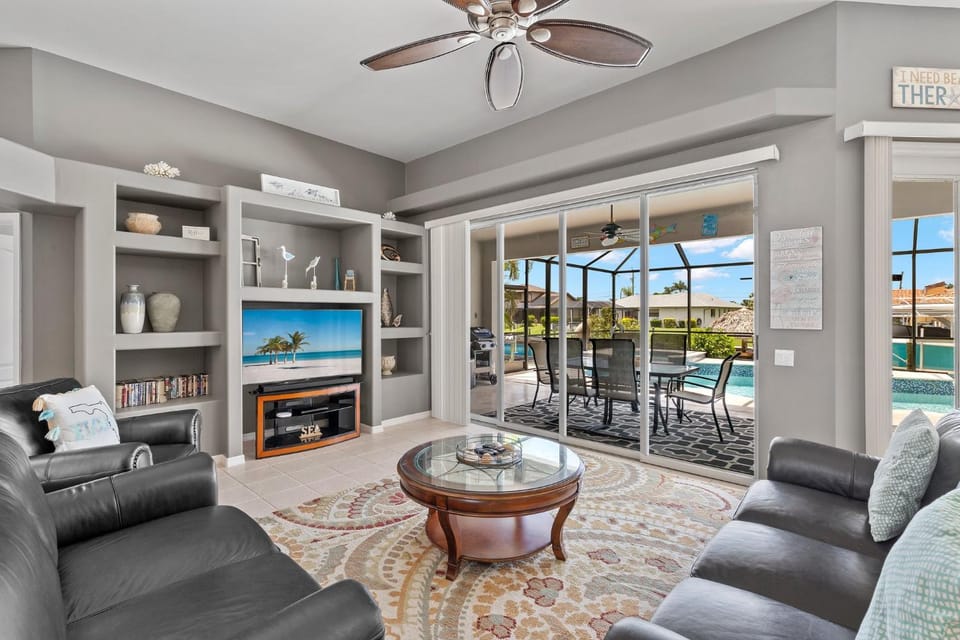 TV and multimedia, Living room, Seating area, Pool view, Swimming pool, furniture