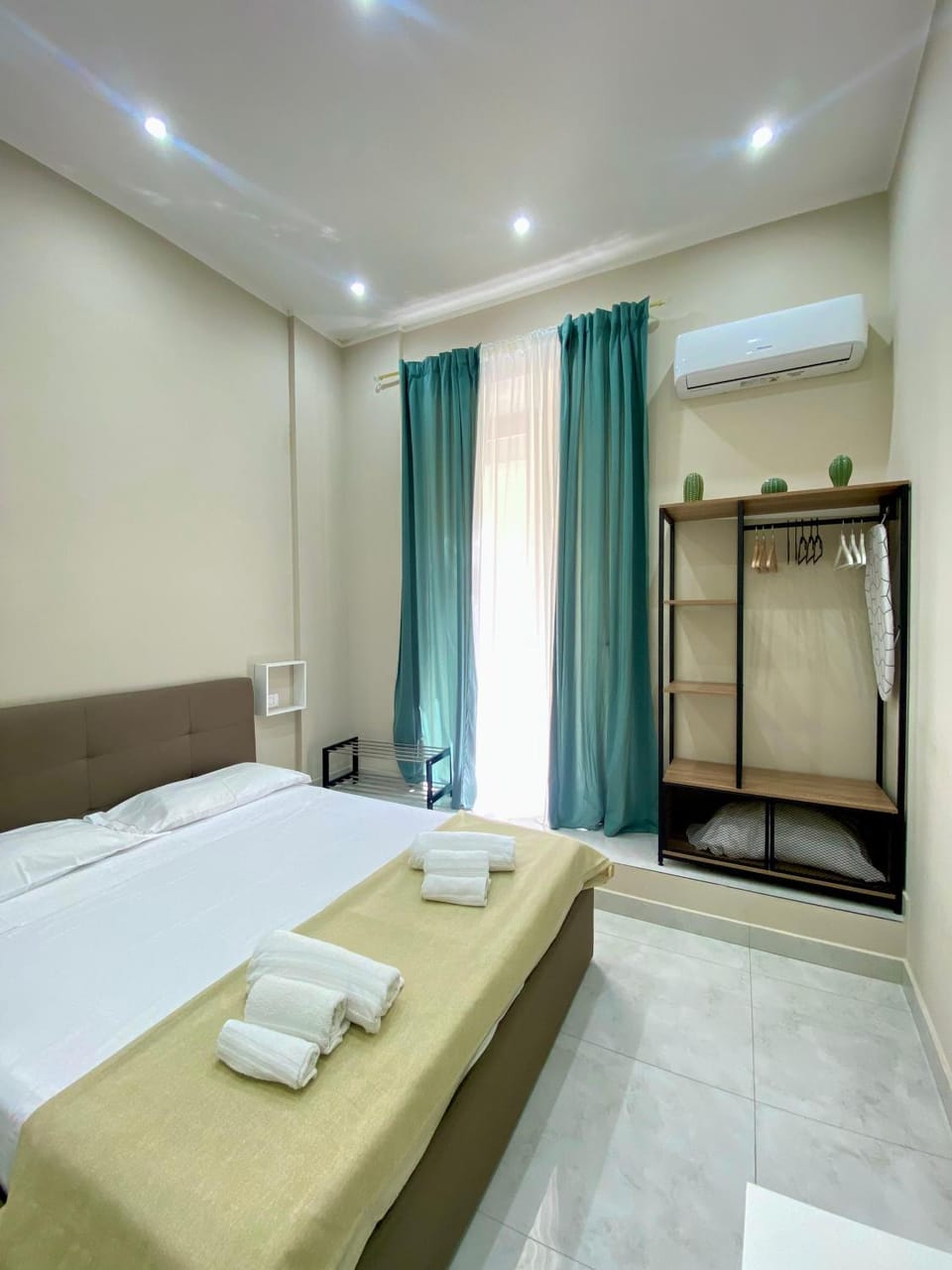 Bedroom, towels, wardrobe, air conditioner
