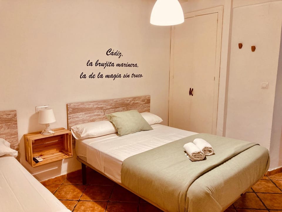 Bed, towels, wardrobe