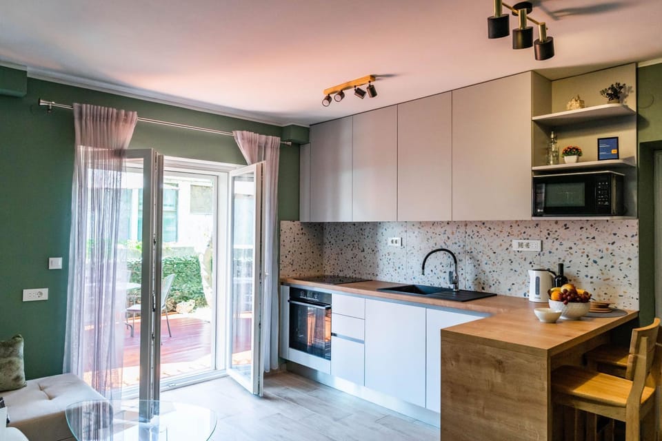 Living room, Lounge or bar, Garden view, dishwasher, stove, kitchen