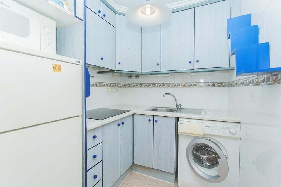Kitchen or kitchenette, washing machine