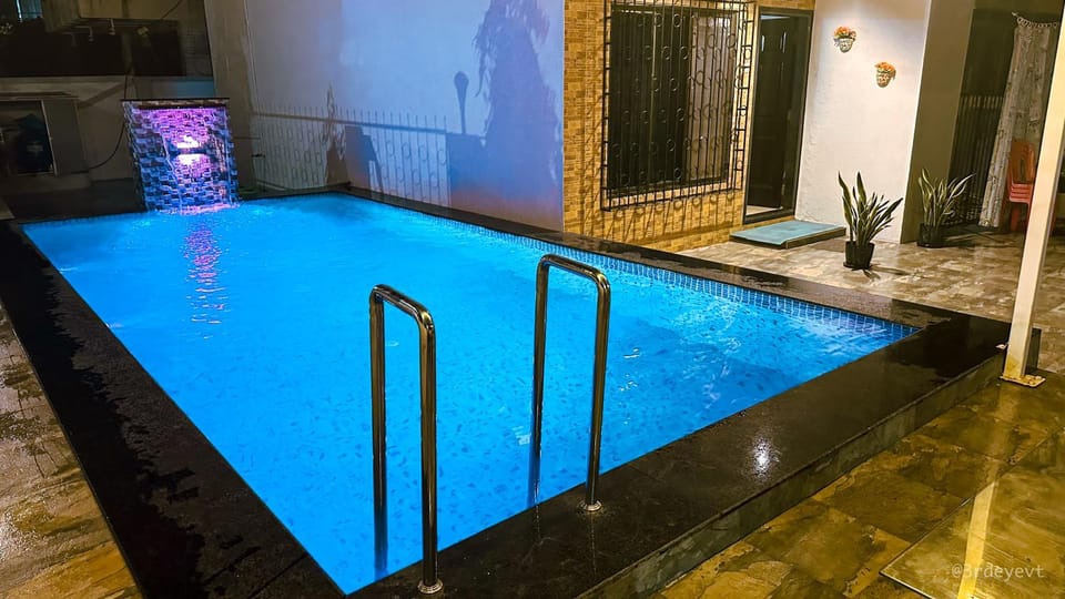 Patio, Night, Seating area, Pool view, Street view, Swimming pool, Quiet street view
