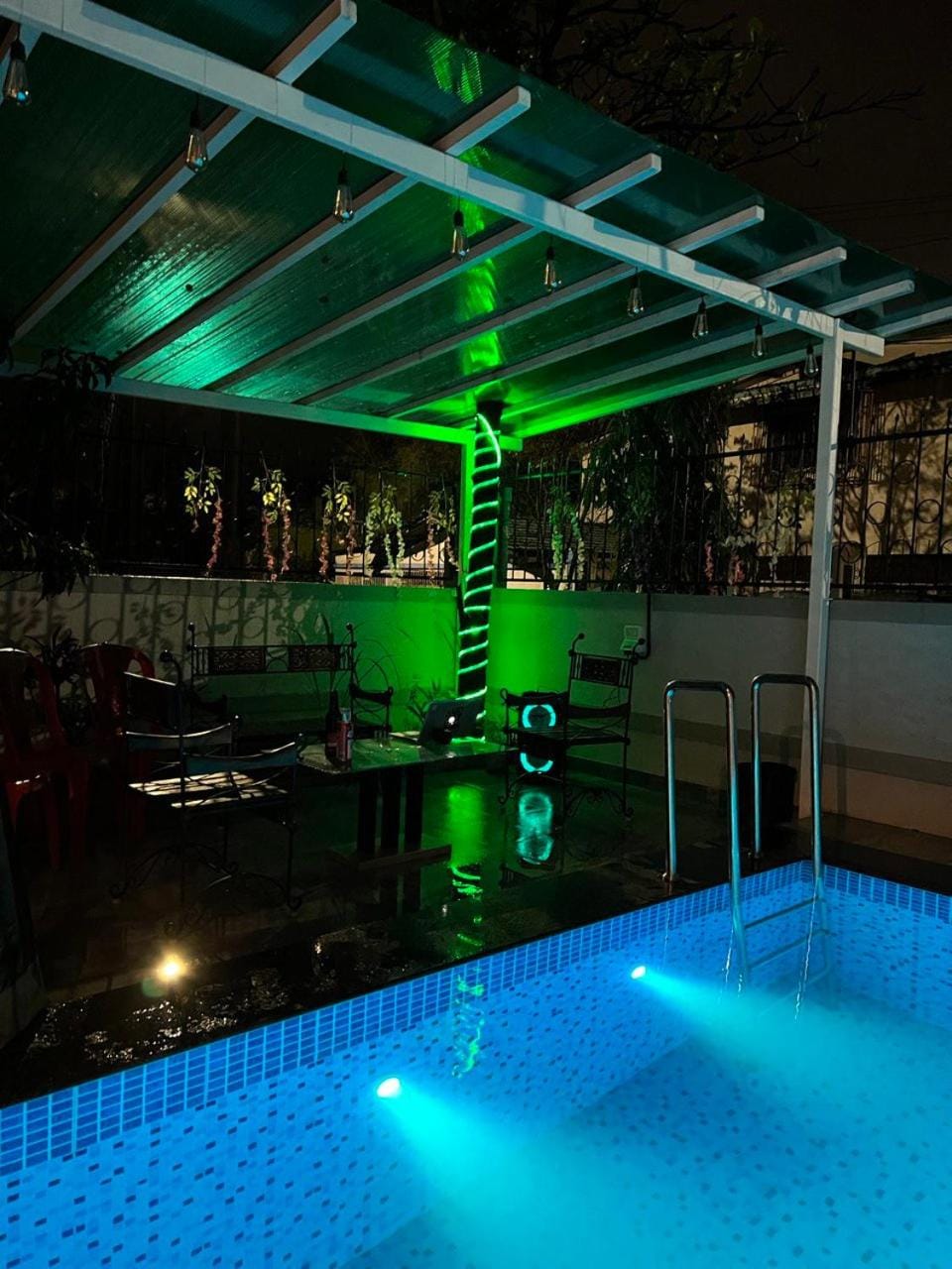 Patio, Night, Seating area, Pool view, Street view, Swimming pool, Quiet street view