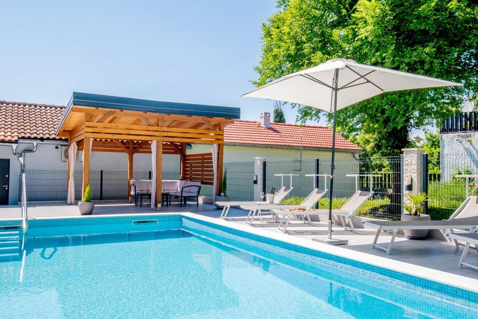 Property building, Patio, Pool view, Swimming pool, sunbed