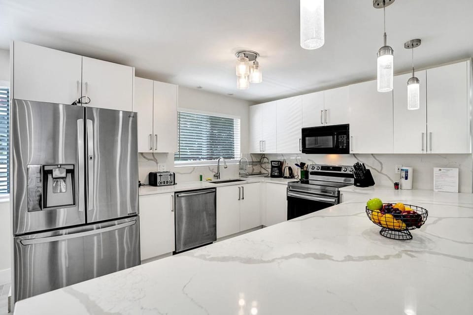 Kitchen or kitchenette, dishwasher, oven, stove, toaster
