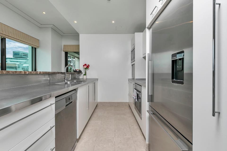 Kitchen or kitchenette, dishwasher, oven, stove