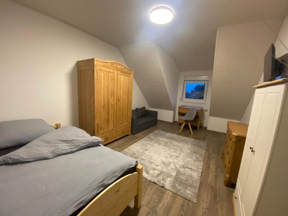 Bed, TV and multimedia, Seating area, Bedroom, hair dresser, wardrobe
