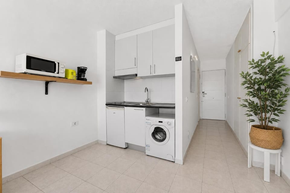 Kitchen or kitchenette, toaster, washing machine
