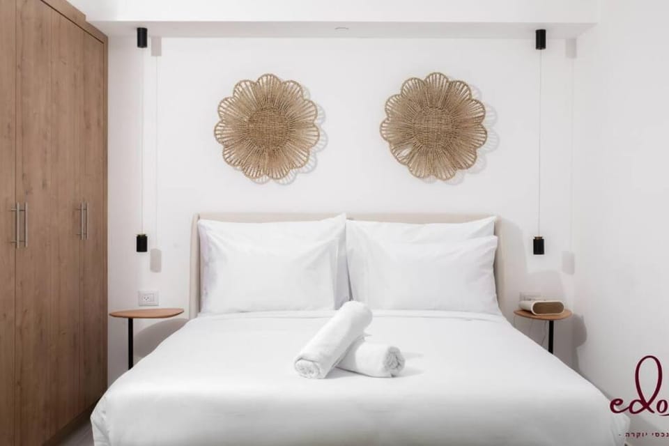 Bed, towels, wardrobe