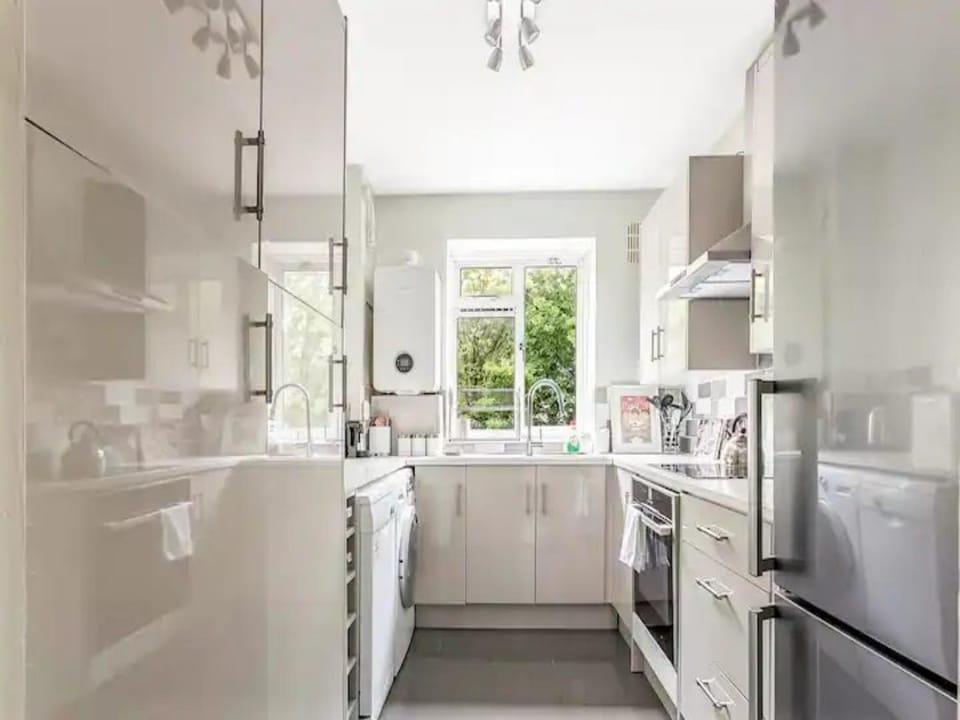 Kitchen or kitchenette, dishwasher, oven, stove, washing machine