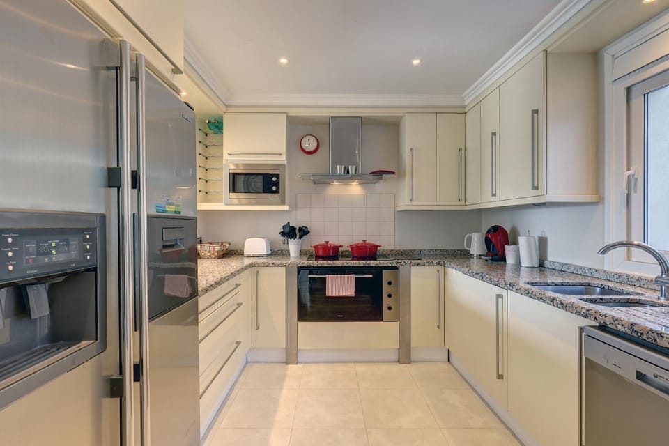 Kitchen or kitchenette, dishwasher, oven, stove, toaster