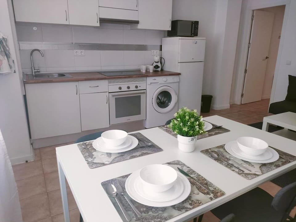 Kitchen or kitchenette, Dining area, oven, stove, toaster, washing machine