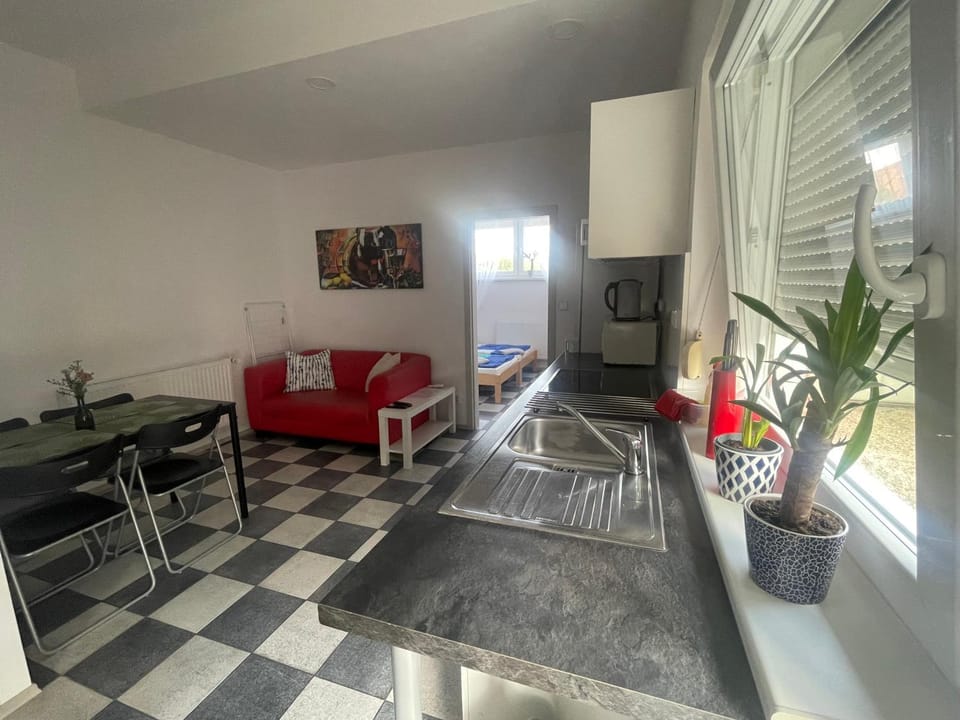 Kitchen or kitchenette, Living room, Seating area, Dining area