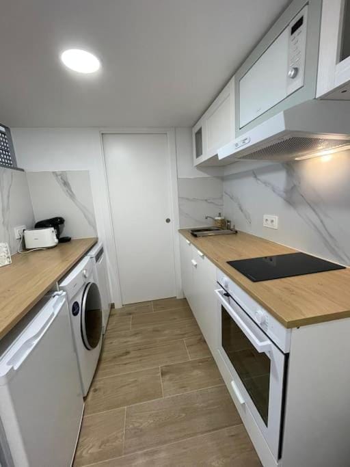 Kitchen or kitchenette, dishwasher, oven, pet friendly, stove, toaster, washing machine, dryer
