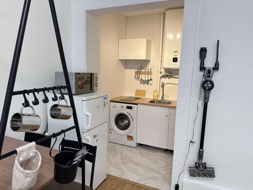 Kitchen or kitchenette, stove, washing machine