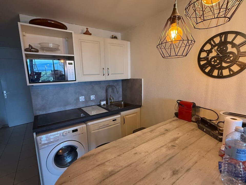 Kitchen or kitchenette, dishwasher, oven, stove, washing machine