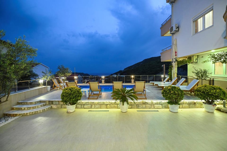 Property building, Patio, Night, Natural landscape, Mountain view, Pool view, Swimming pool