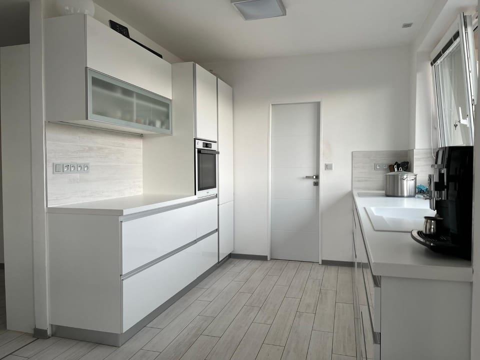 Kitchen or kitchenette, dishwasher, oven, stove
