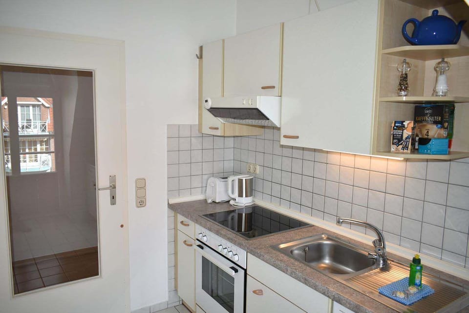 Kitchen or kitchenette, dishwasher, oven, stove