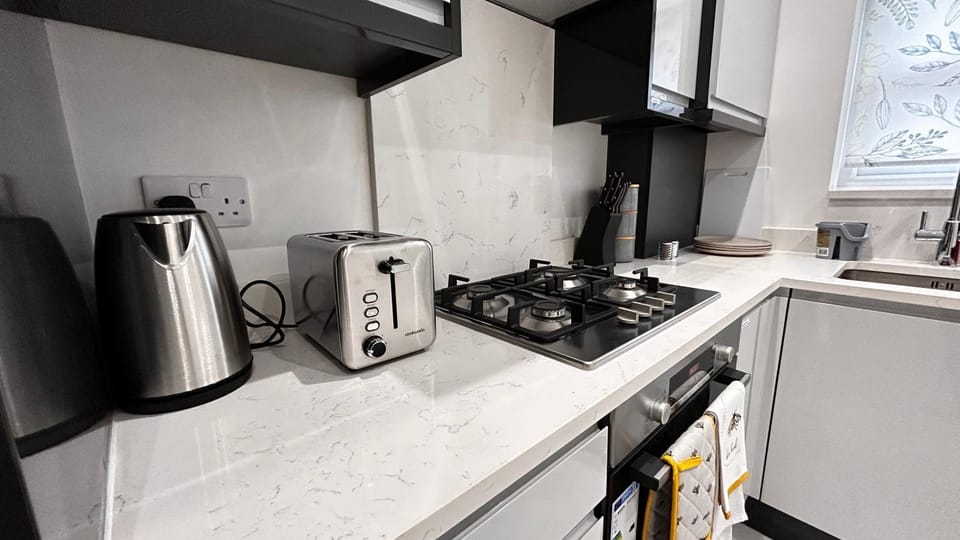 Kitchen or kitchenette, stove, toaster