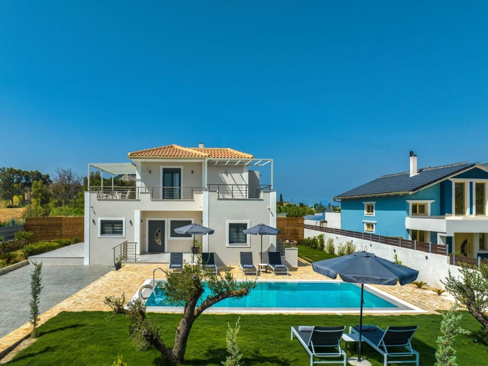 Property building, Day, Natural landscape, Pool view, Swimming pool, sunbed