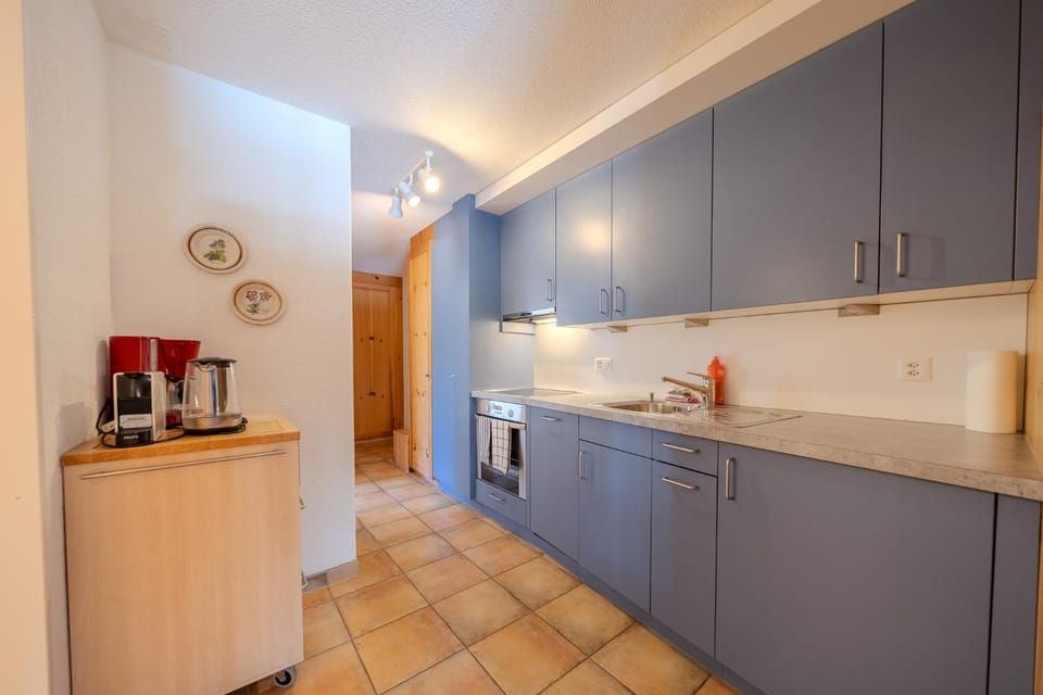 Kitchen or kitchenette, dishwasher, oven, stove