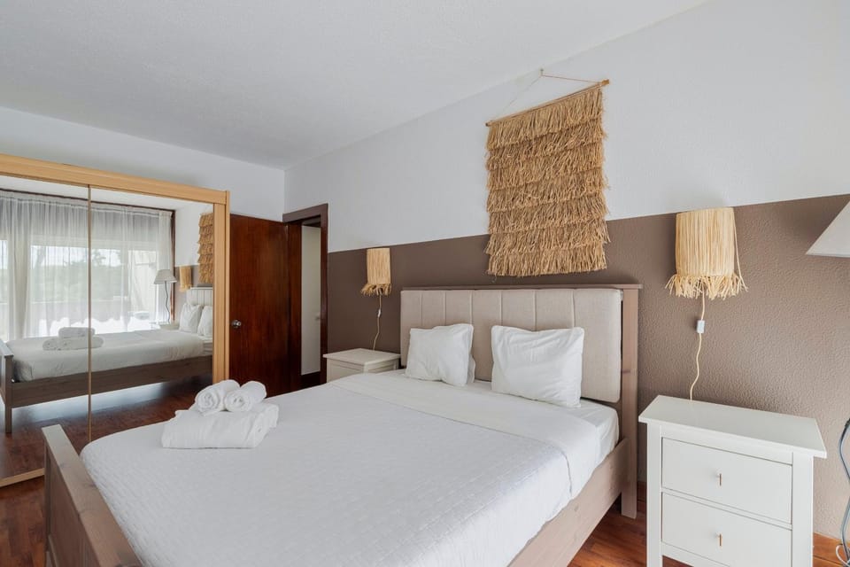 Bed, towels, wardrobe