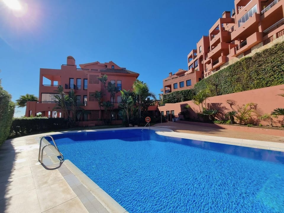 Property building, Day, Pool view, Swimming pool, sunbed