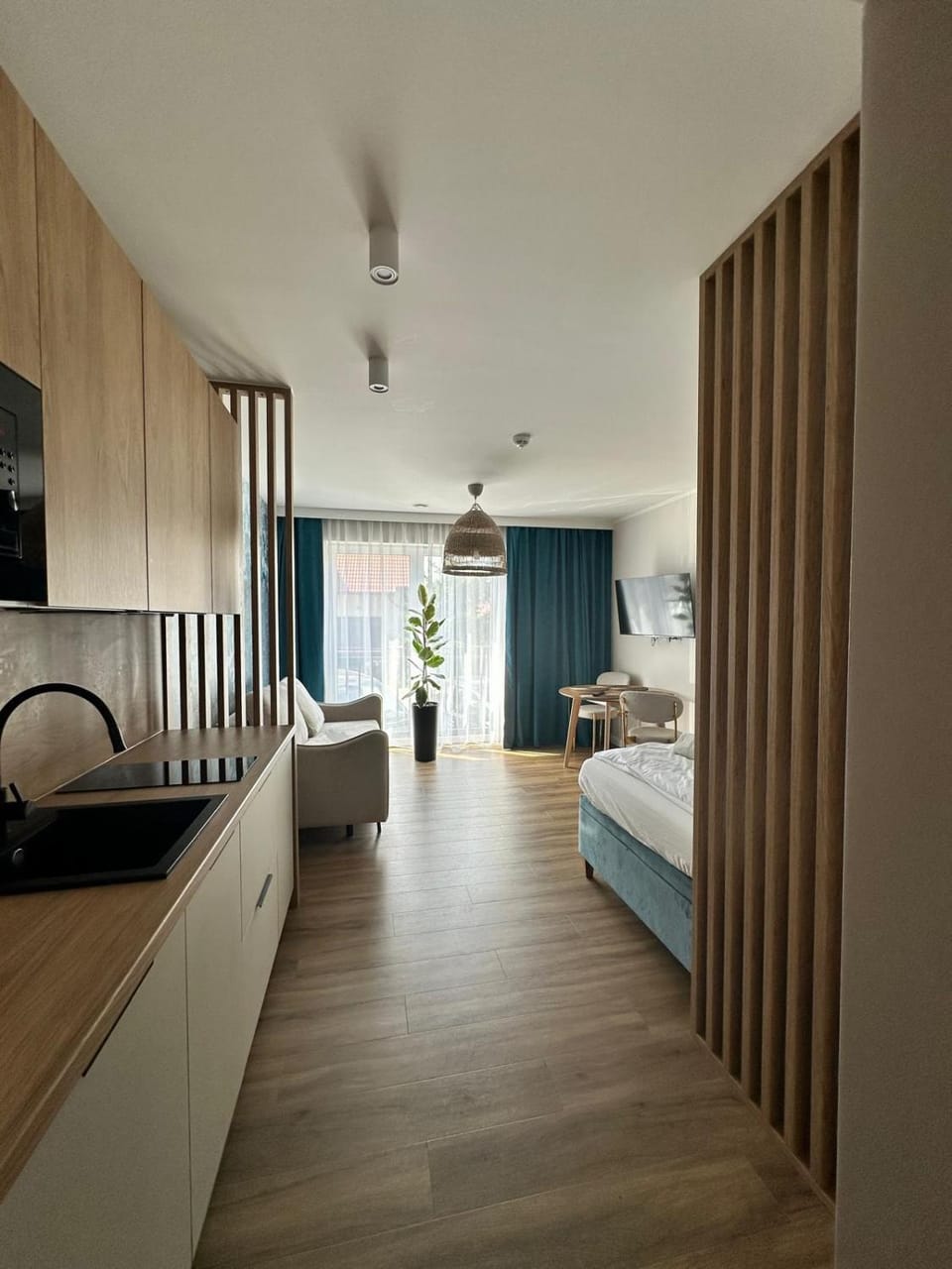 Bed, Kitchen or kitchenette, microwave, stove