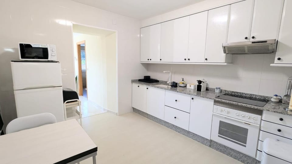 Kitchen or kitchenette, dishwasher, oven, stove, toaster