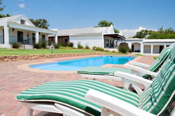Property building, Pool view, Swimming pool, sunbed