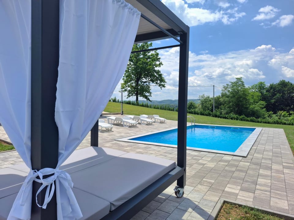 Patio, Day, Natural landscape, Pool view, Swimming pool, sunbed