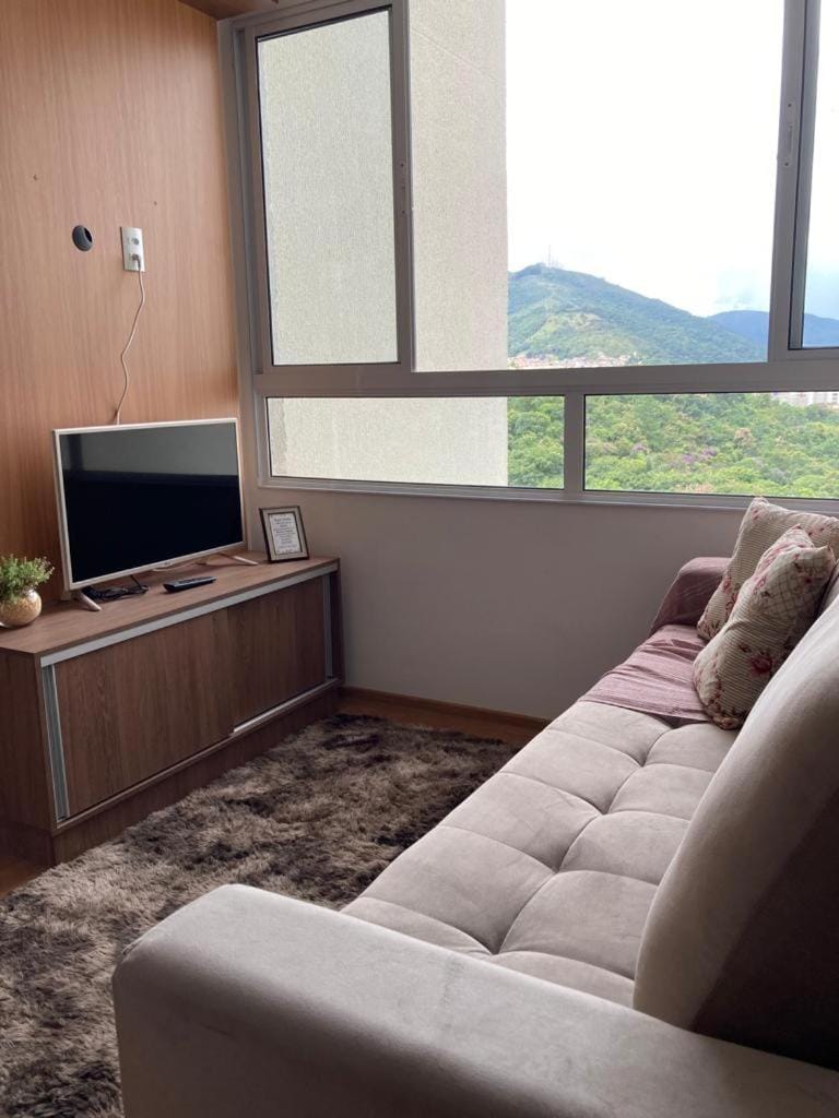 Communal lounge/ TV room, Natural landscape, TV and multimedia, Living room, Seating area, Mountain view