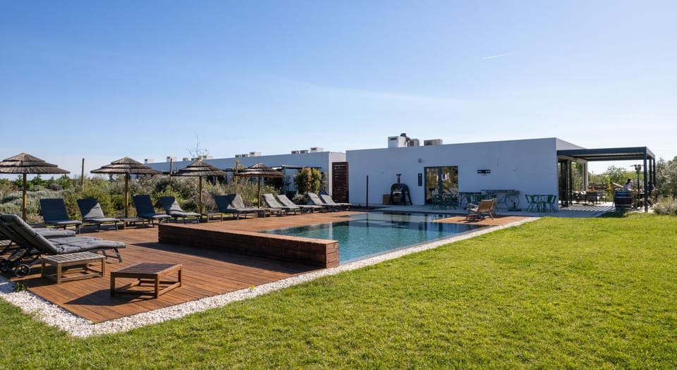 Property building, Natural landscape, Pool view, Swimming pool, sunbed