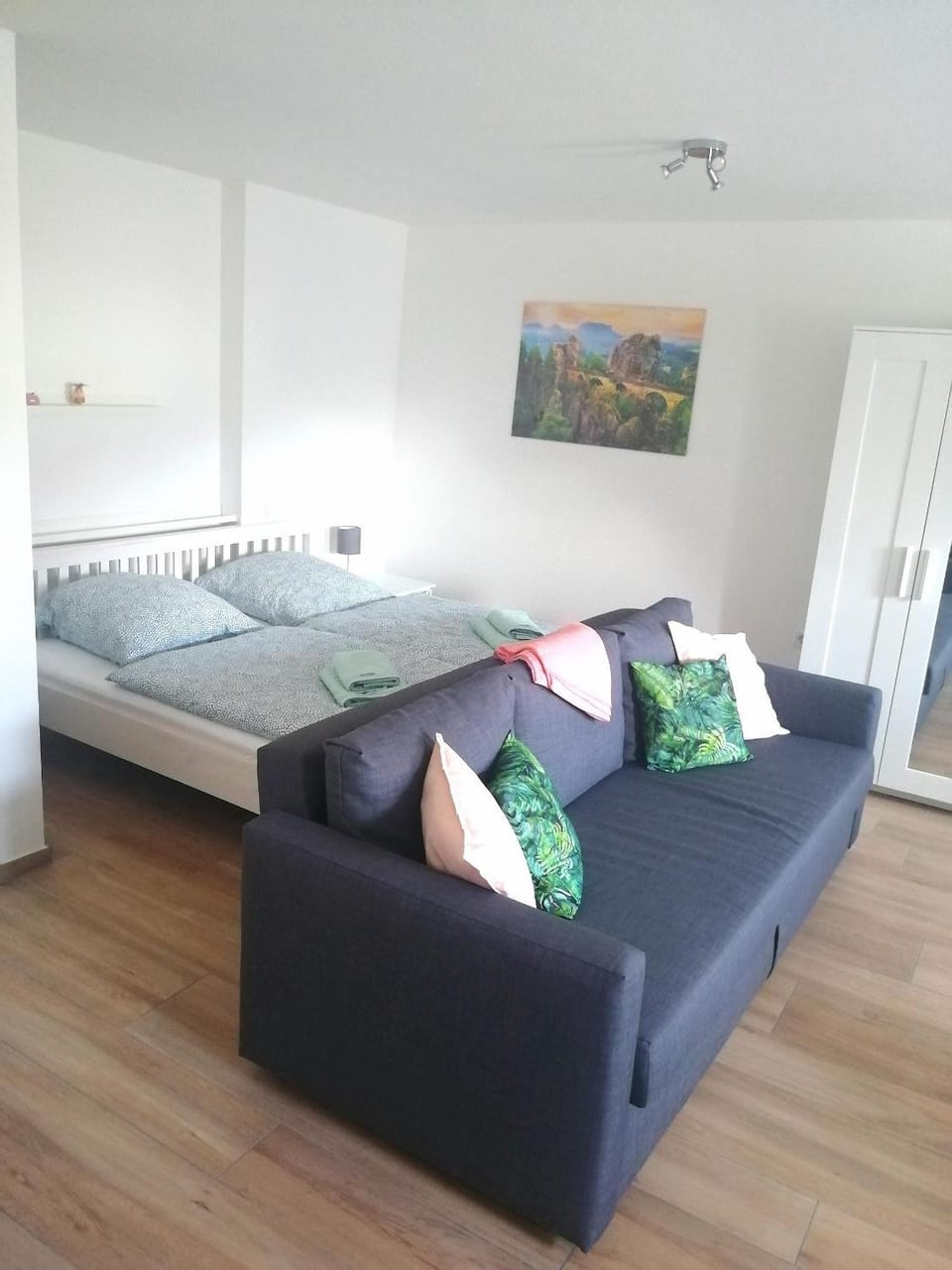 Bed, Living room, Seating area, Bedroom