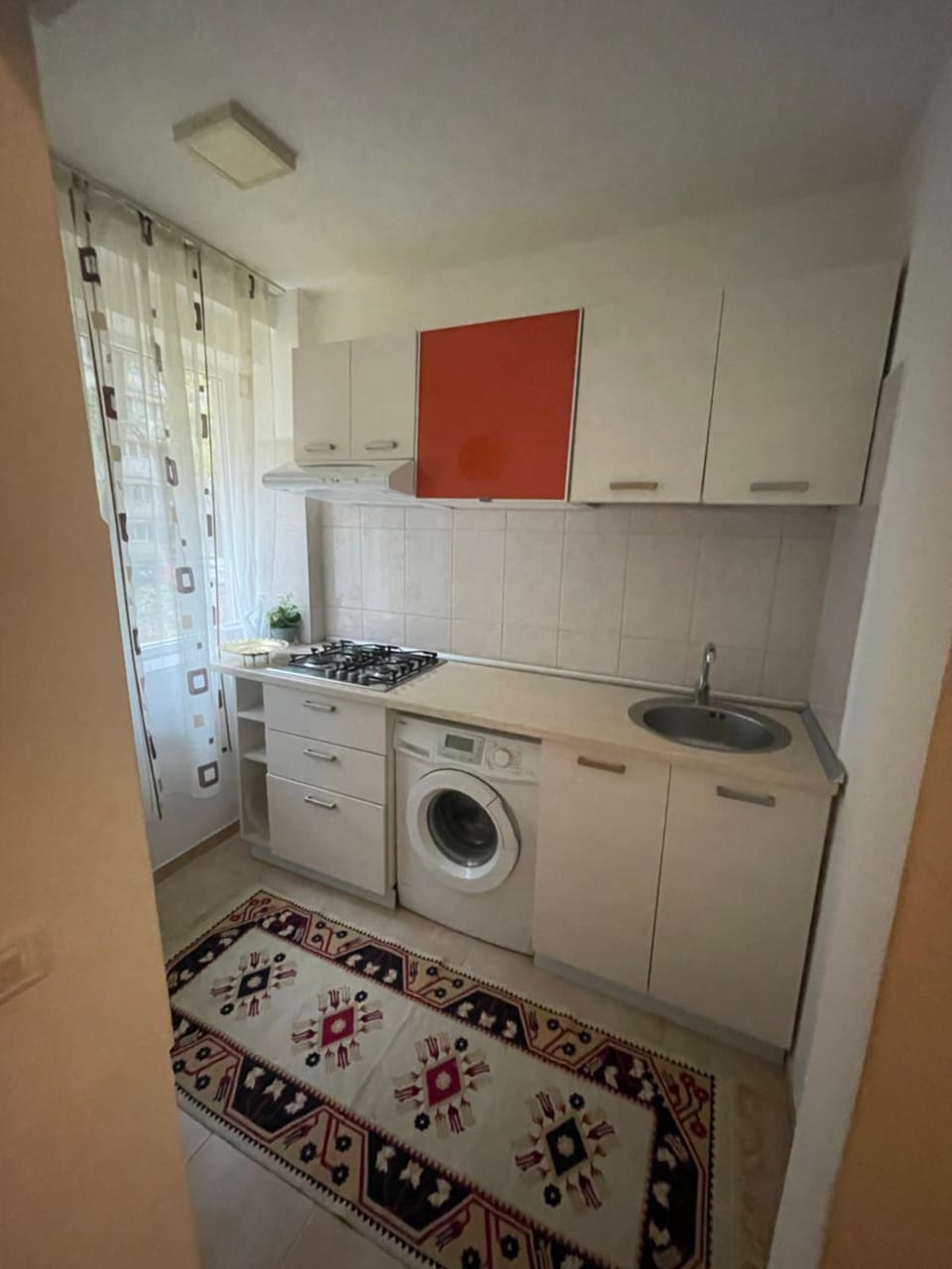Kitchen or kitchenette, stove, washing machine