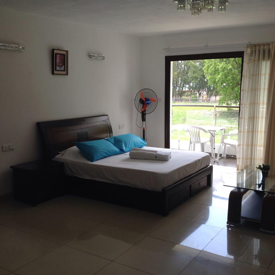 Patio, Bed, Day, Photo of the whole room, Bedroom