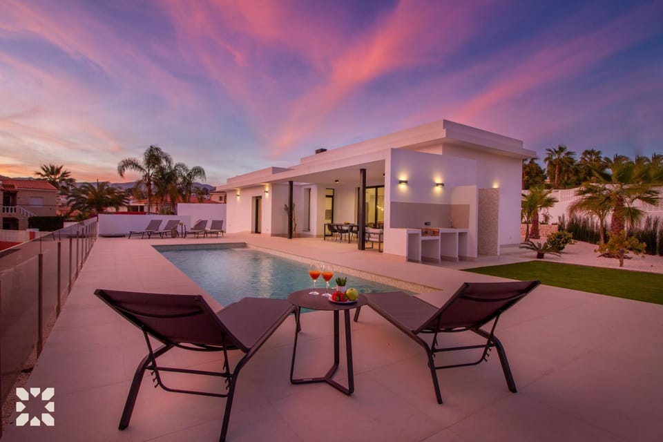 Property building, Patio, Day, Natural landscape, Pool view, Swimming pool, Sunrise, Sunset, sunbed