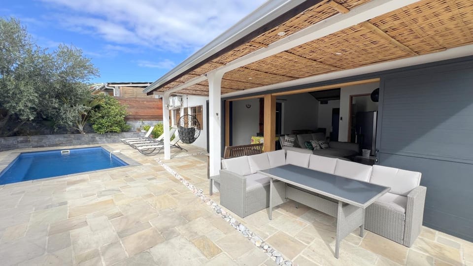 Property building, Patio, Living room, Swimming pool