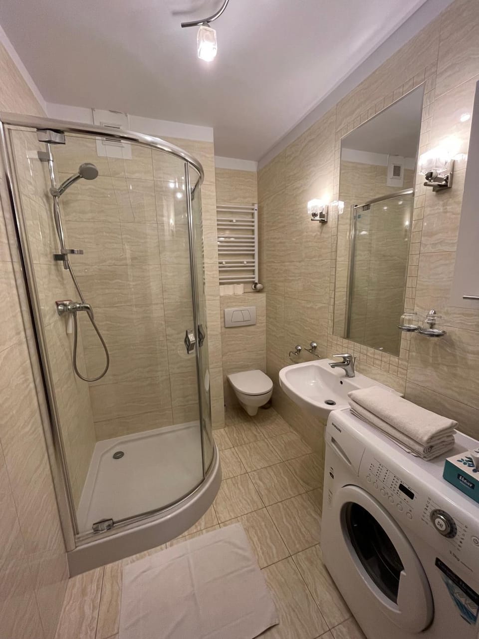 Shower, Toilet, Bathroom, towels, washing machine, dryer