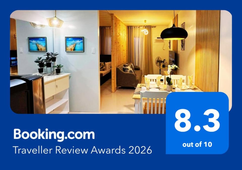 Bed, Property logo or sign, Kitchen or kitchenette, Photo of the whole room, Logo/Certificate/Sign, Bedroom, Text overlay, Certificate/Award